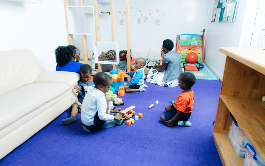 Children playing and learning together in a classroom