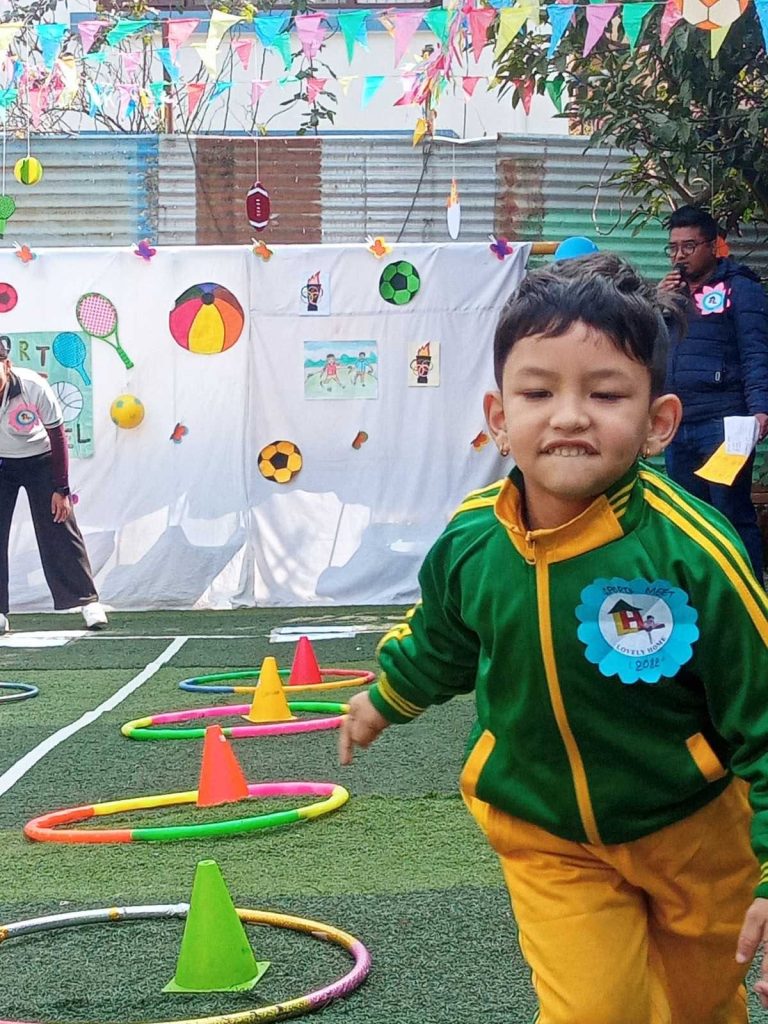 Preschooler in Lovely Home uniform completing an obstacle course at the annual Sports Meet